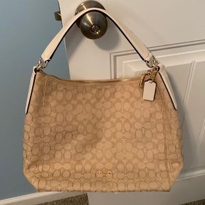 Coach shoulder bag.  Only used once. Tan w/ classic C emblems/Non smoking home.